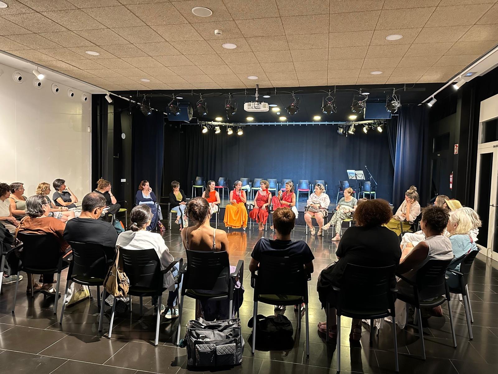A dialogue circle after a presentation, with audience members seated around a central space